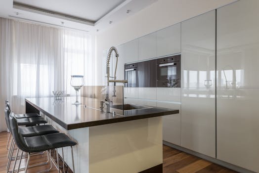 Stylish modern kitchen with an island and sleek cabinetry, perfect for contemporary living.