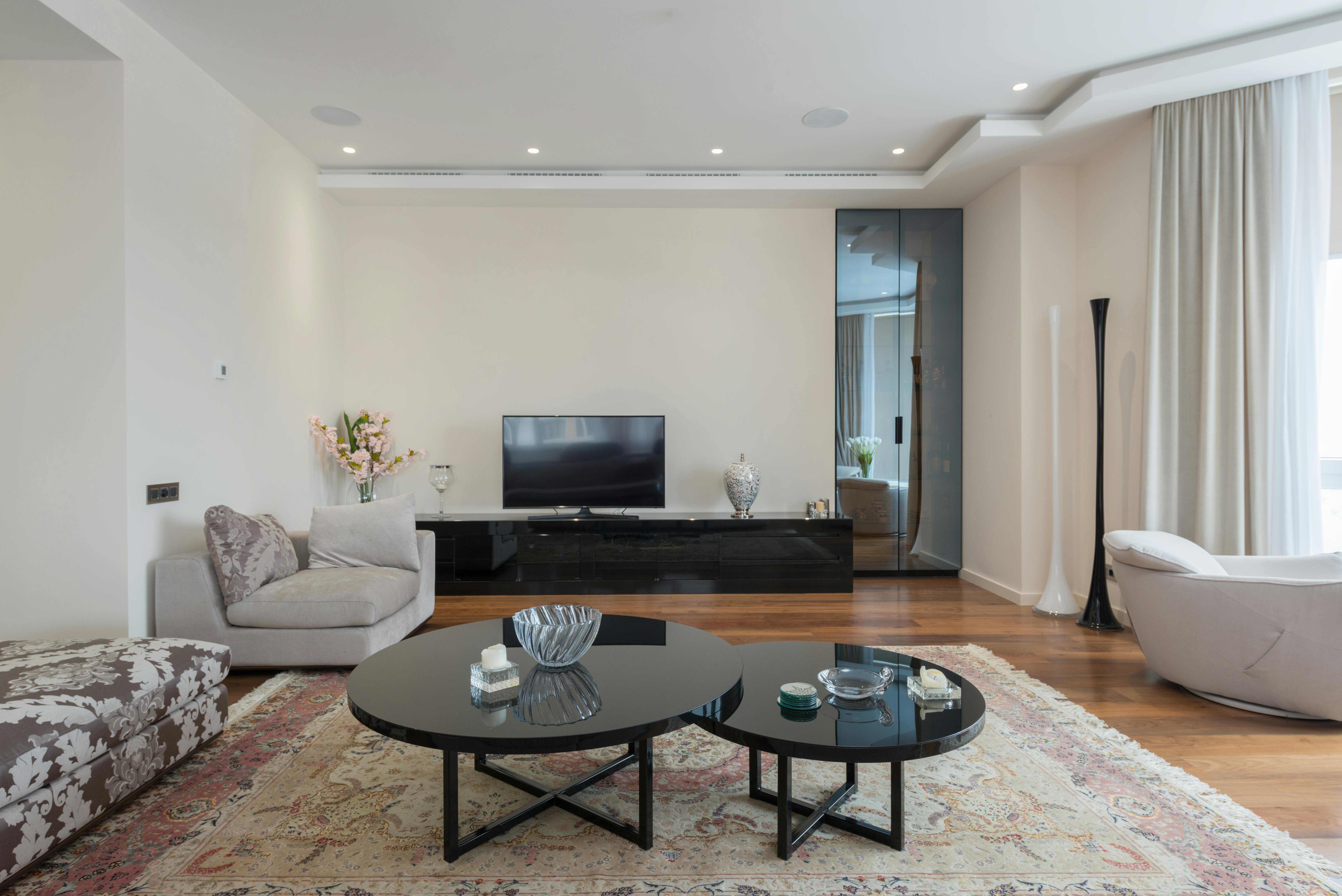 living room with cozy sofas ad modern tv in modern apartment