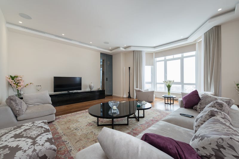 Modern apartment lift lobby with residents waiting politely