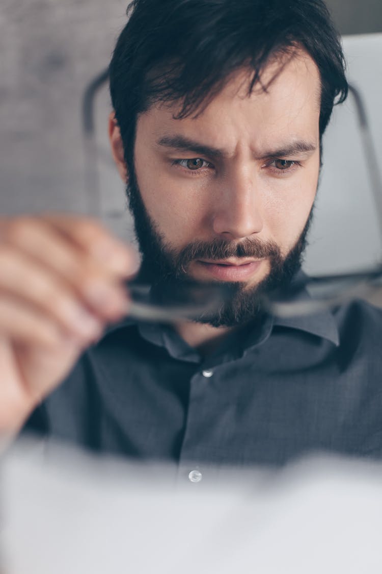 A Man Looking At The Document