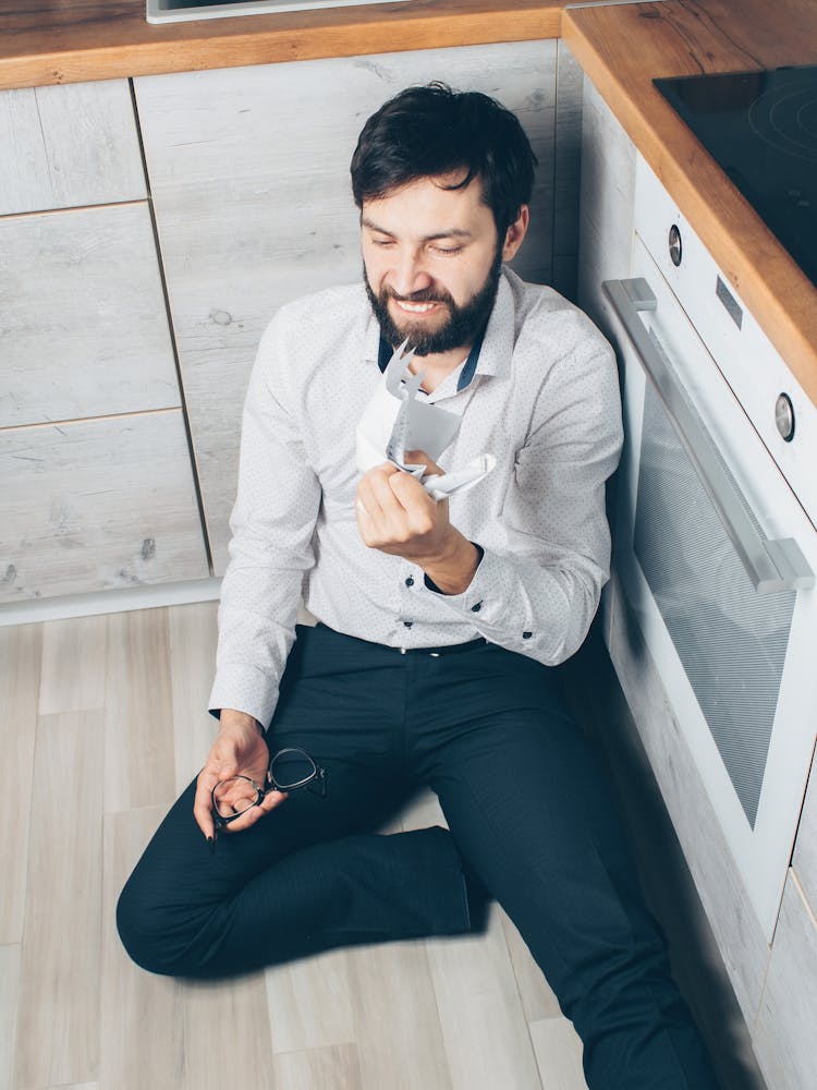 An Angry Man Crumpling A Paper