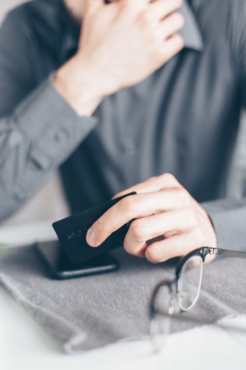 A Person Holding Bank Card