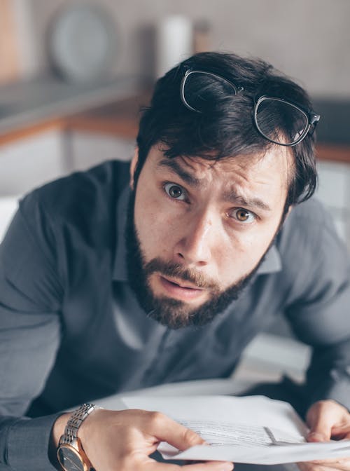 Photo of Bearded Man Feeling Confused