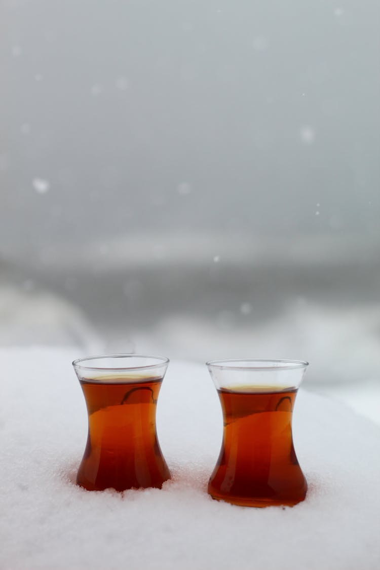 Turkish Tea In Traditional Glass On Snow Surface