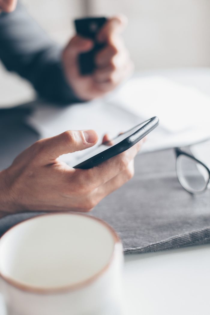 Person using a smartphone for an online financial transaction