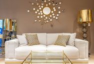 Couch with cushions in decorated room