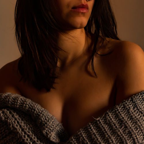 Free Close-up portrait capturing intimate mood with a woman in a cozy sweater Stock Photo