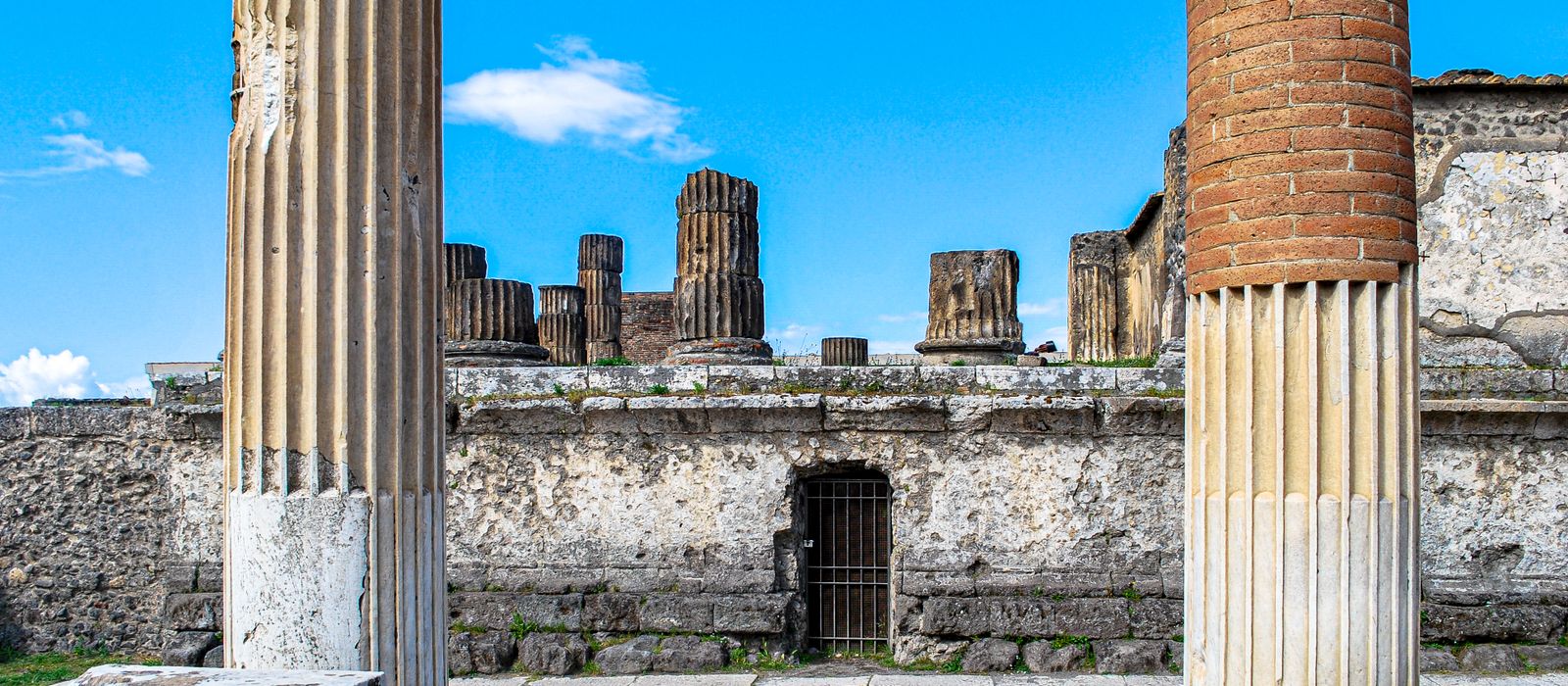 Explore the ancient Roman columns and ruins at Pompeii, showcasing historical architecture. Perfect for travel and history enthusiasts.