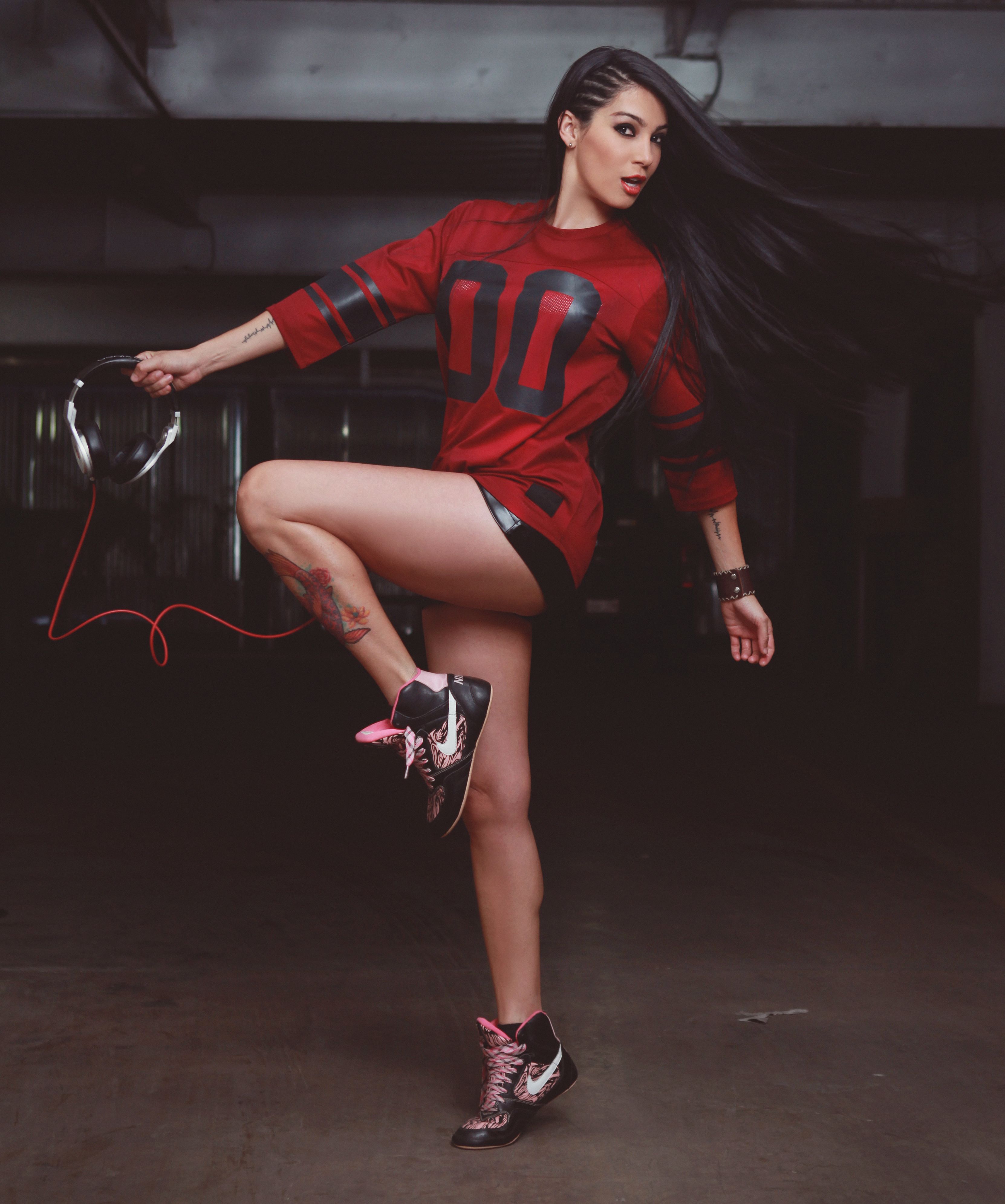 A Woman with Long Black Hair Wearing a Red Shirt · Free Stock Photo