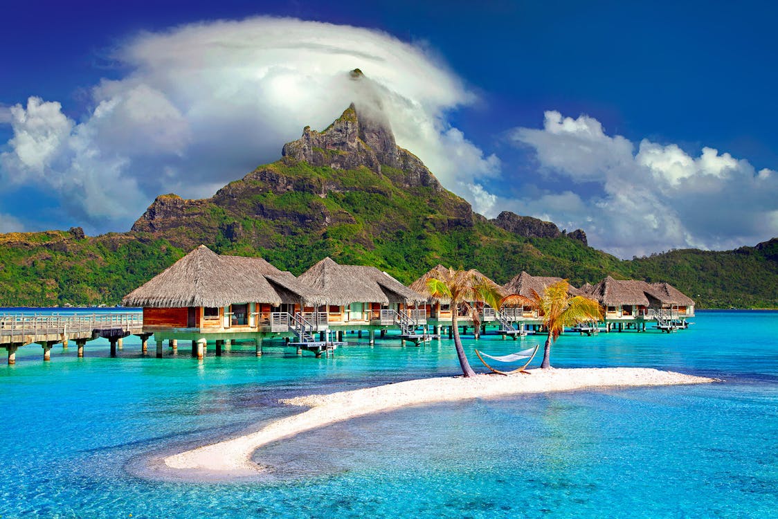 Free Cottages In The Middle Of Beach Stock Photo