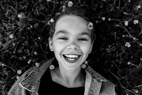 Free A Grayscale of a Girl Smiling Stock Photo