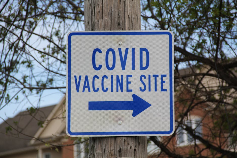 Sign directing to COVID vaccine site in a suburban setting, Deerfield, IL.