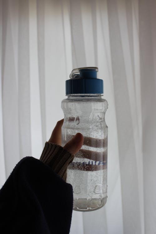 A Person Holding a Drinking Bottle