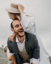 Happy newlywed couple having fun on wedding day
