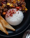 Boiled rice with chopped vegetables and minced meat
