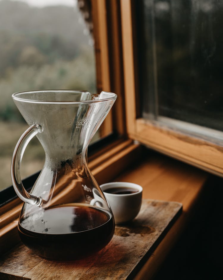 Chemex With Coffee And Cup Near Window