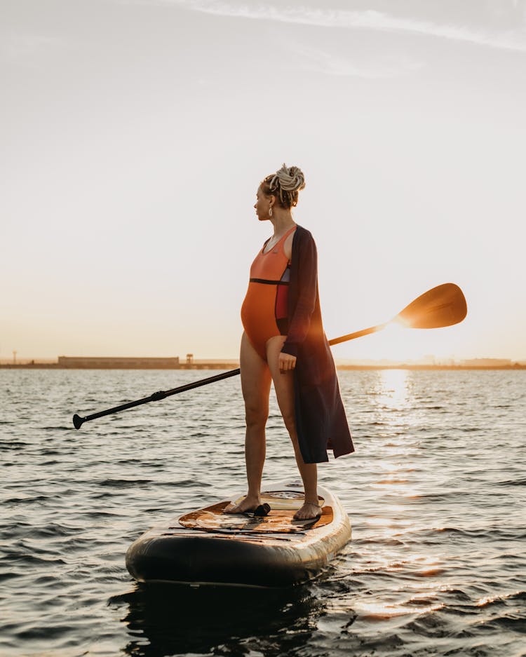 Woman On Boat With Paddle