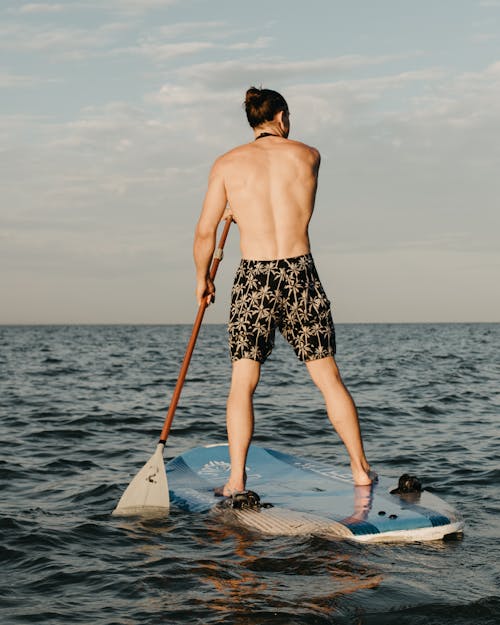 A Man Paddleboarding