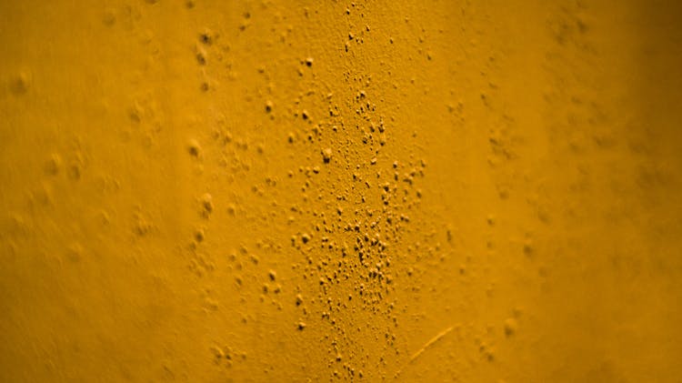 Uneven Yellow Wall With Irregular Grains