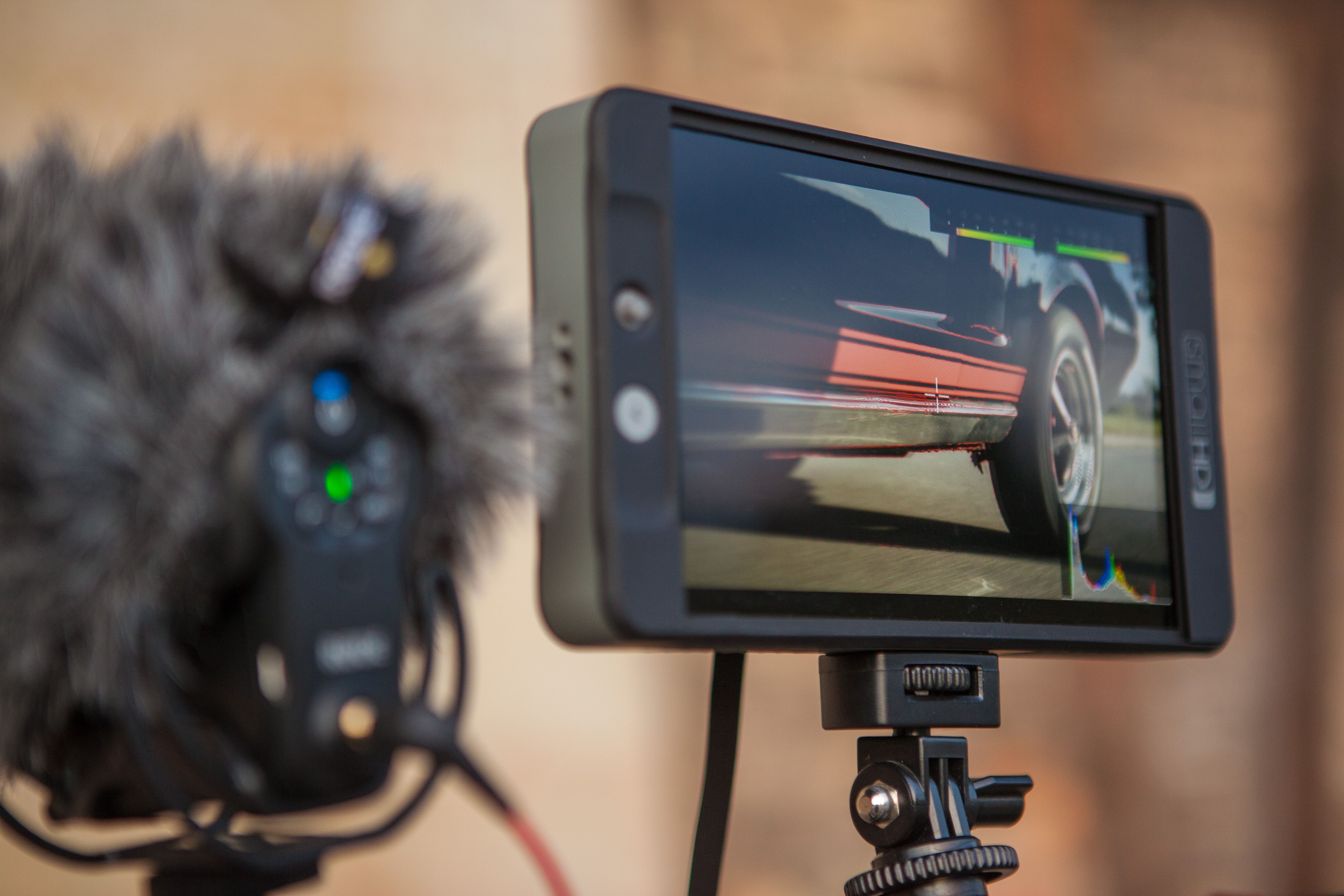 A smartphone attached to a stick