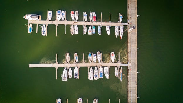 Aerial photo of boats docked at a marina in Stralsund, Germany, showcasing a geometric arrangement.