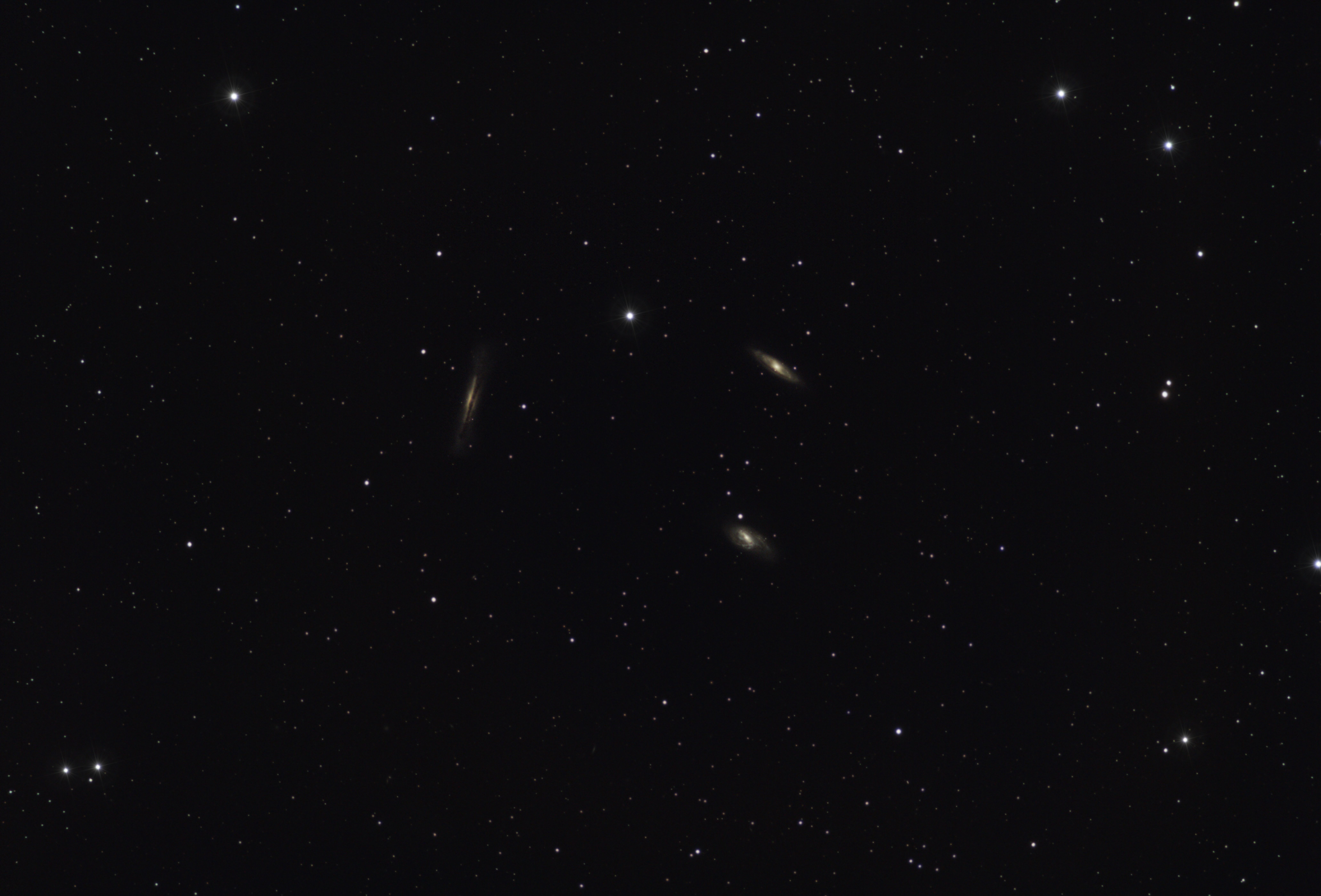 A breathtaking view of distant galaxies amidst a starry night sky filled with countless stars.