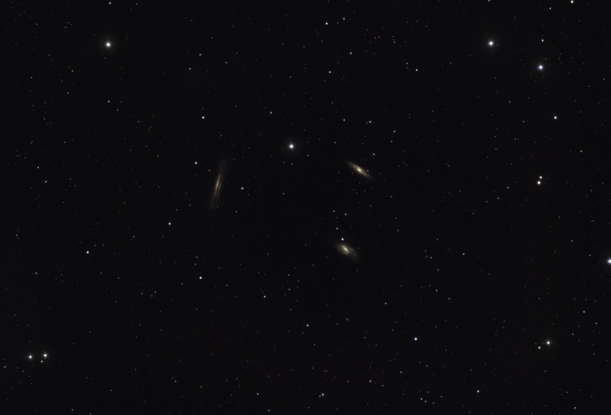 A breathtaking view of distant galaxies amidst a starry night sky filled with countless stars.