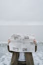 A Person Reading Newspaper at the Beach