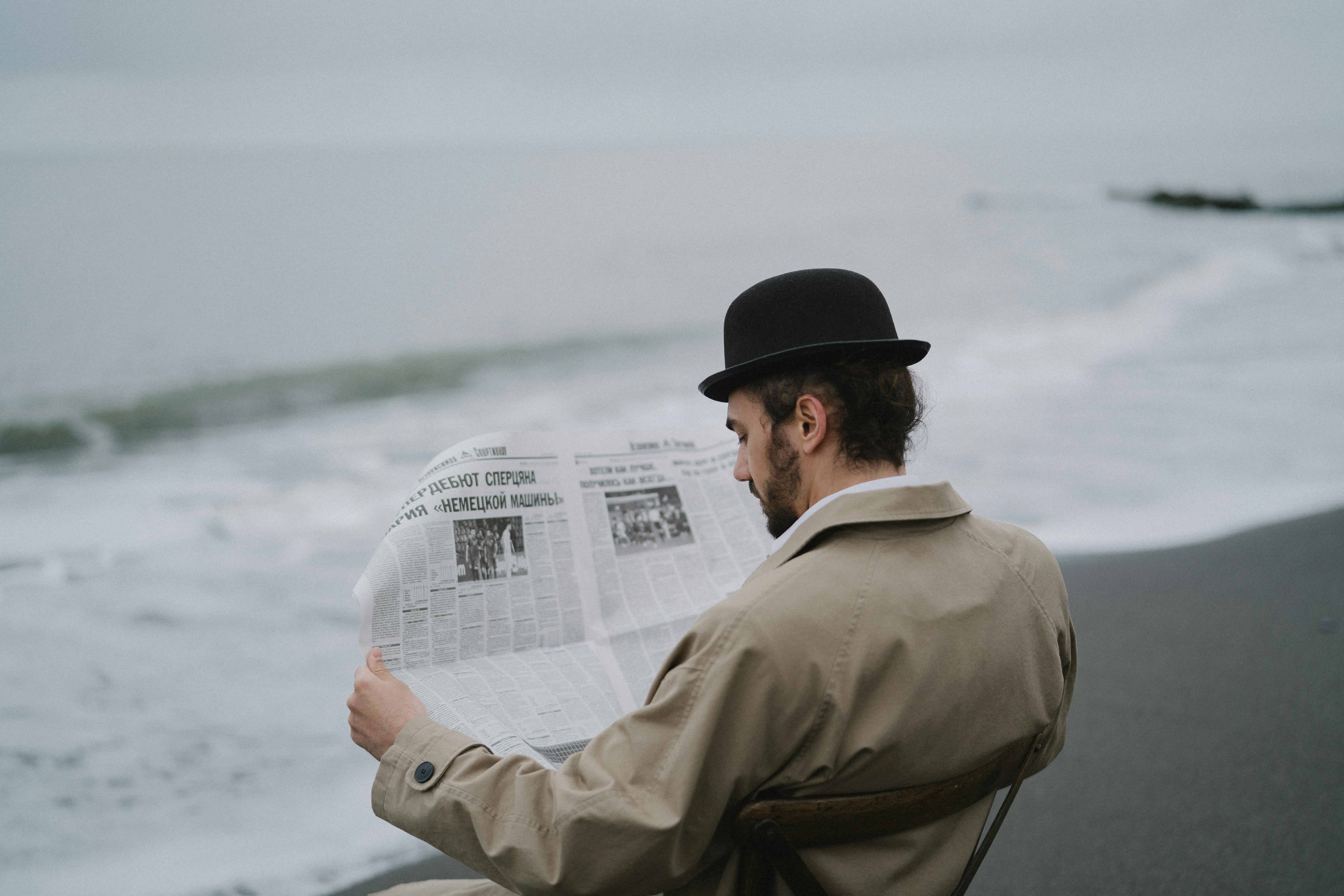 a man reading a newspaper