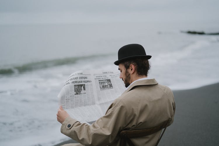 A Man Reading A Newspaper