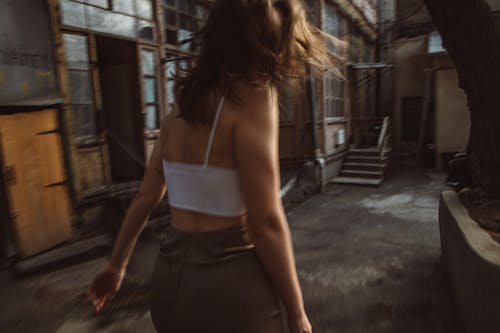 Backview of Woman wearing Whitev Tank Top 