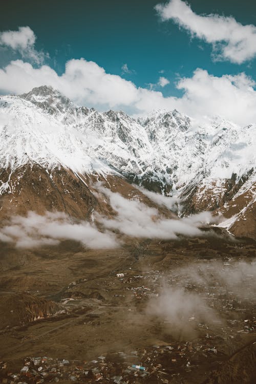 Aerial Shot of Snow Covered Mountains