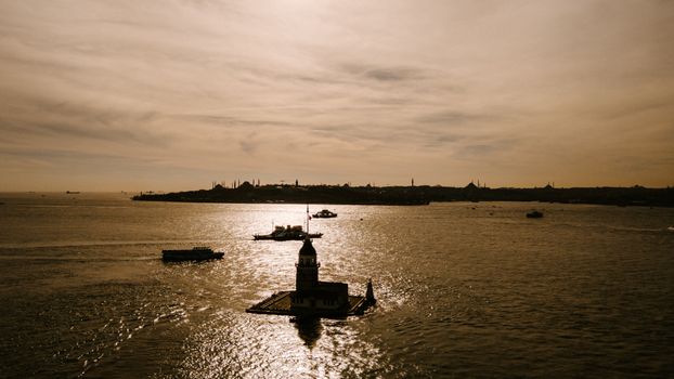 Silhouetted Aerial View of Maidens Lighthouse Tower at Sunset 