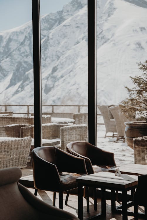 Tables and Chairs Inside the Restaurant with Mountain View