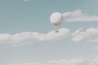 White Hot Air Balloon in the Sky