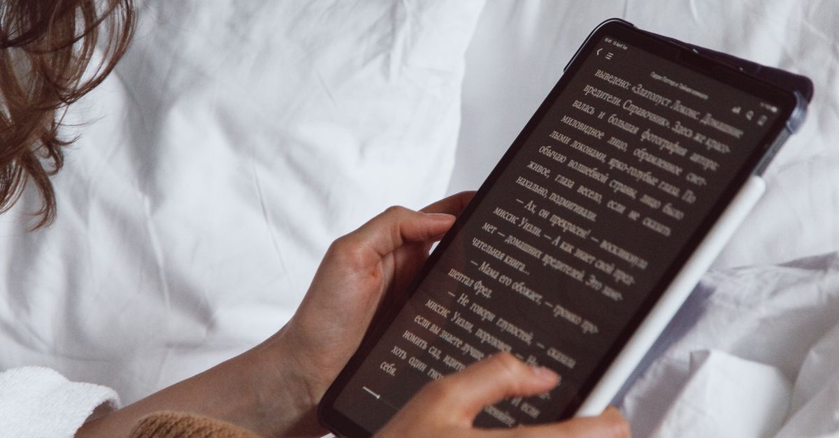 Woman Reading on Tablet · Free Stock Photo