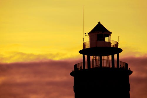 Free stock photo of lighthouse, sunset, yellow sky