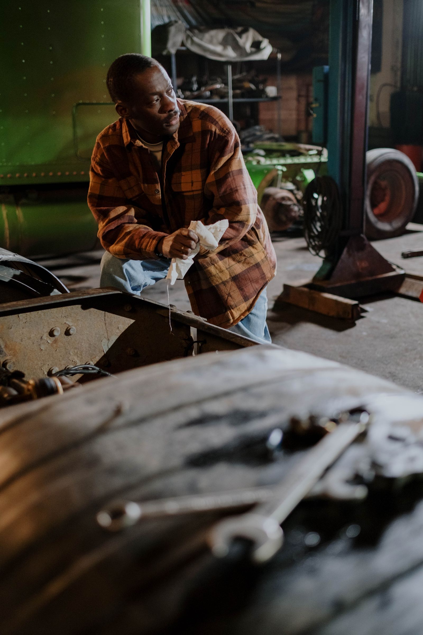 African American mechanic in a garage workshop