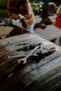 Silver and Red Nail Cutter on Brown Wooden Table