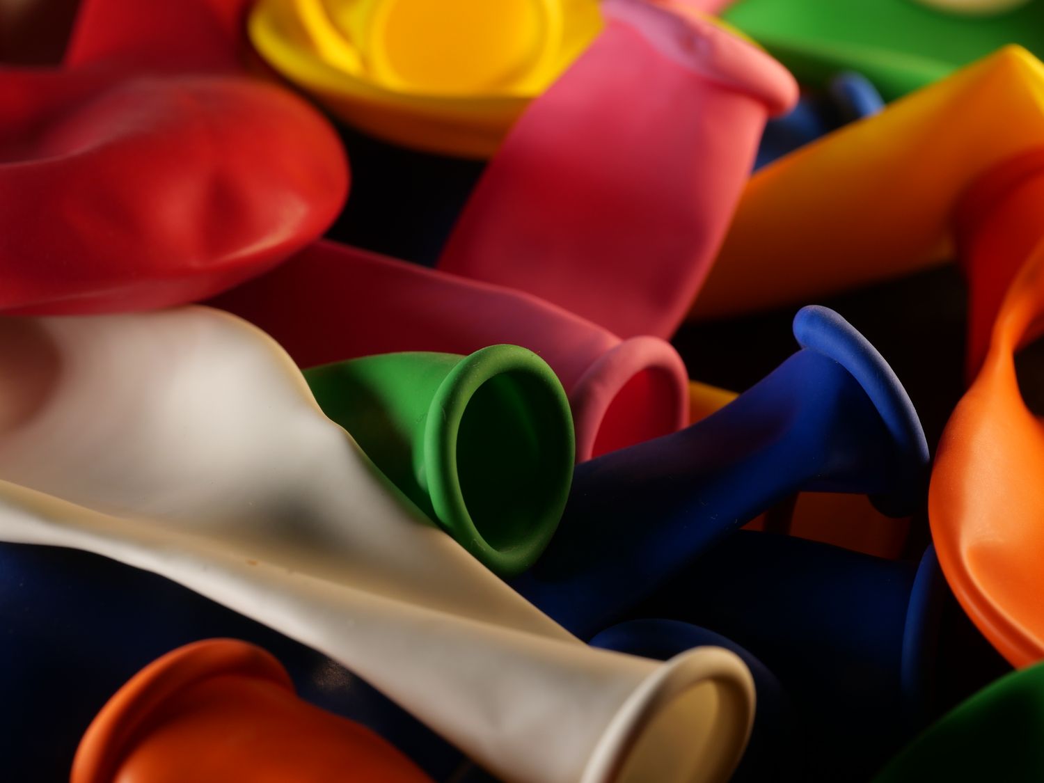 Close-up view of colorful uninflated party balloons showing their material and finish