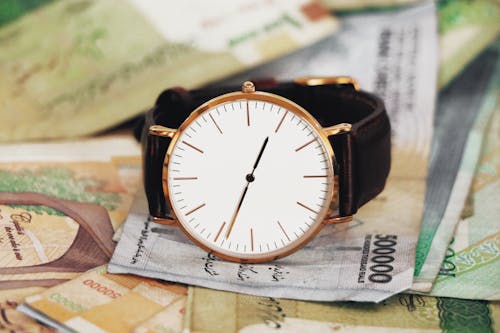 Free Wrist Watch on Money Stock Photo