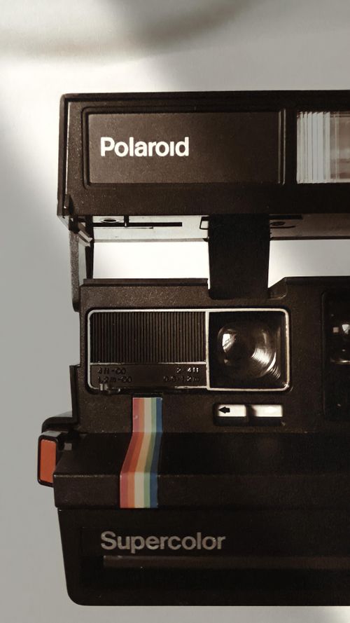 Free Close-up of a classic Polaroid Supercolor camera with retro design elements. Stock Photo