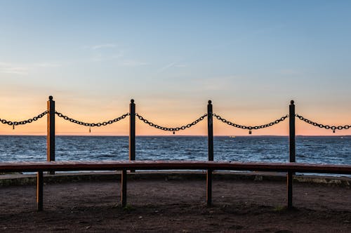 Four Metal Poles With Link Chains