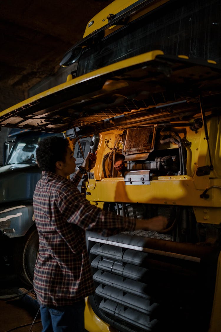 A Man Checking The Truck