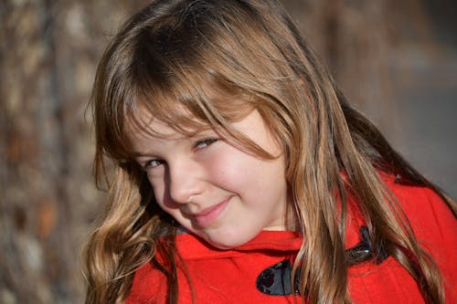 Blonde Girl Wearing Red Toggle Jacke