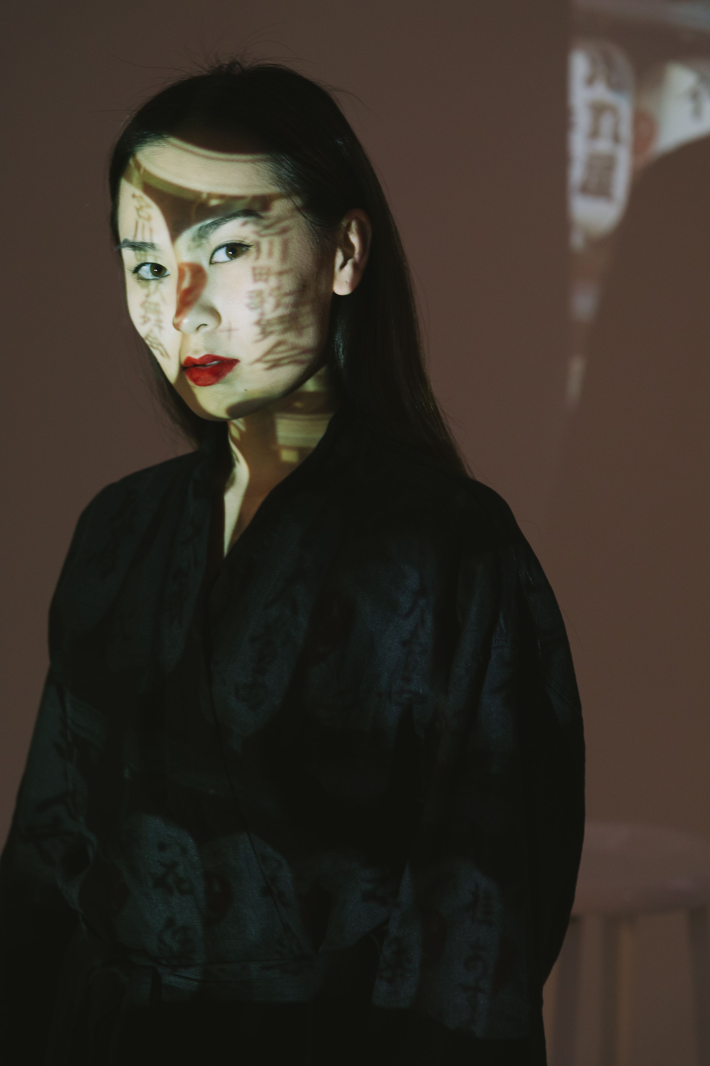 Woman in Red Lipstick Posing in Black Kimono · Free Stock Photo