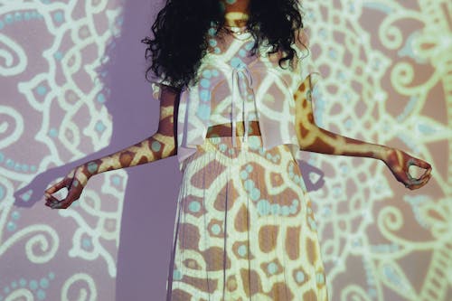 Woman in White and Brown Leopard Print Dress