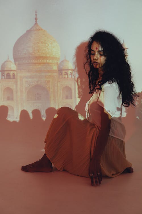Projected Taj Mahal Photo on a Woman Sitting on the Floor