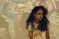 Woman Sitting in White Dress with Nose Ring