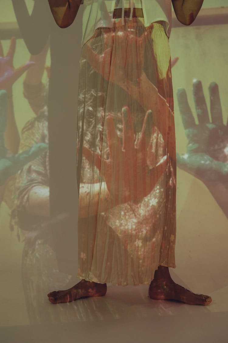 Projection Photography Of A Barefoot Person Wearing A Long Skirt